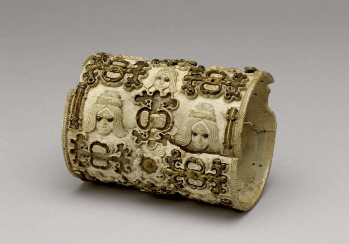 Benin bronzes, historical transformation. Carved Benin ivory armlet inlaid with brass; one example to the artworks.